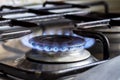 Burning gas burner on a home kitchen Royalty Free Stock Photo