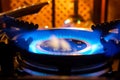 Burning gas stove. Blue flame of gas burner Royalty Free Stock Photo
