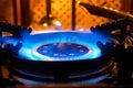 Burning gas stove. Blue flame of gas burner Royalty Free Stock Photo