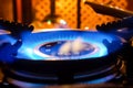 Burning gas stove. Blue flame of gas burner Royalty Free Stock Photo