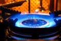 Burning gas stove. Blue flame of gas burner Royalty Free Stock Photo