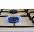 Burning gas, gas stove burner, hob in kitchen. Royalty Free Stock Photo