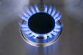 Burning gas, gas stove burner, hob in the kitchen. Blue gas stove in the dark Royalty Free Stock Photo