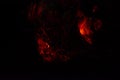 Burning and glowing charcoal close-up. Red coals with fire on a black background Royalty Free Stock Photo