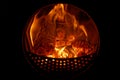 Burning and glowing logs in a fireplace stove Royalty Free Stock Photo