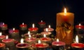 Burning golden candles on black background. grief, mourning or Christmas concept