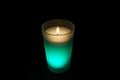 Burning green candle