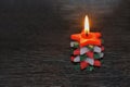 Burning green,red and white Christmas candle pine tree in Chrismas season. Royalty Free Stock Photo