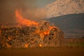 Burning hay stacks 1 ton bales on fire blazing hot with embers flying around lower yakima valley