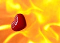 Burning heart with flames against fire background Royalty Free Stock Photo