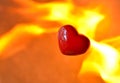 Burning heart with flames against fire background Royalty Free Stock Photo