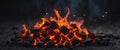 Burning Hot Coals and Glowing Embers Amid Dark Ashes. Royalty Free Stock Photo