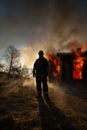 Burning house and fire fighters Royalty Free Stock Photo