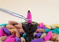 Burning incense cone for aromatherapy on ceramic holder Royalty Free Stock Photo