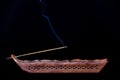 Burning incense stick on black Royalty Free Stock Photo