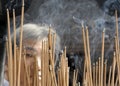 Burning incense sticks in front of a pagoda Royalty Free Stock Photo