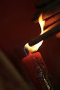 Burning incense sticks on red candle to celebrate the tradition Royalty Free Stock Photo