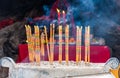 Burning incense and worship the gods in the buddhist temple in Qingyan Ancient Town, Guizhou province, China. The old town is a