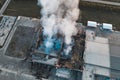 Burning industrial building with fire, huge thick smoke and burnt roof, aerial view Royalty Free Stock Photo