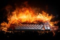 Burning keyboard on black background. Burnout syndrome, deadline, burnout at work. Computer keyboard on fire as a symbol of stress