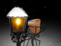 Burning lantern in the snow. Christmas lantern. Christmas lantern in the snow in the evening