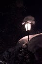 Burning lantern with snow covered, in the night Royalty Free Stock Photo