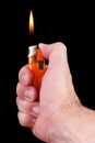 Burning lighter in hand. Royalty Free Stock Photo
