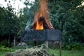 Burning logs in a brazier. Picnic time Royalty Free Stock Photo