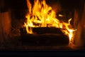 burning logs in the fire of a barbecue or stove or fireplace Royalty Free Stock Photo