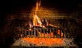 Burning logs in a Winter fireplace Royalty Free Stock Photo