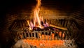 Burning logs in a Winter fireplace Royalty Free Stock Photo