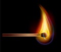 Burning match on a black background