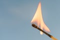 Burning match on a blue background Royalty Free Stock Photo