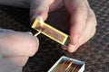 Burning match. Close-up of a hand strike a match. Match box