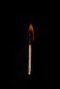 Burning match on a completely black background Royalty Free Stock Photo