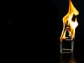 Burning match house with black background, fire house model property Insurance