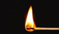 Burning match, isolated on black Royalty Free Stock Photo