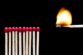 A burning match near other matches Royalty Free Stock Photo