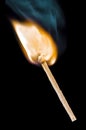 Burning match over black background Royalty Free Stock Photo
