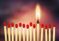 Burning match standing up Royalty Free Stock Photo