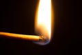 burning matchstick on black background Royalty Free Stock Photo