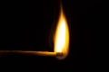 burning matchstick on black background Royalty Free Stock Photo
