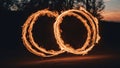 burning number 0 A fire hoop spinning in the darkness, creating a mesmerizing pattern of flames and smoke