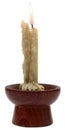 Burning old candle vintage wooden candlestick.