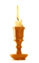 Burning old candle vintage wooden candlestick. Isolated on white background. Royalty Free Stock Photo