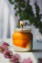 Burning orange candle