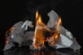 Burning paper on a black background. Fire and ashes from writing, memories Royalty Free Stock Photo