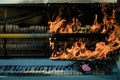 Burning piano, musical style, grunge instrument.