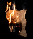 Burning piece of crumpled paper Royalty Free Stock Photo