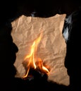 Burning piece of crumpled paper Royalty Free Stock Photo
